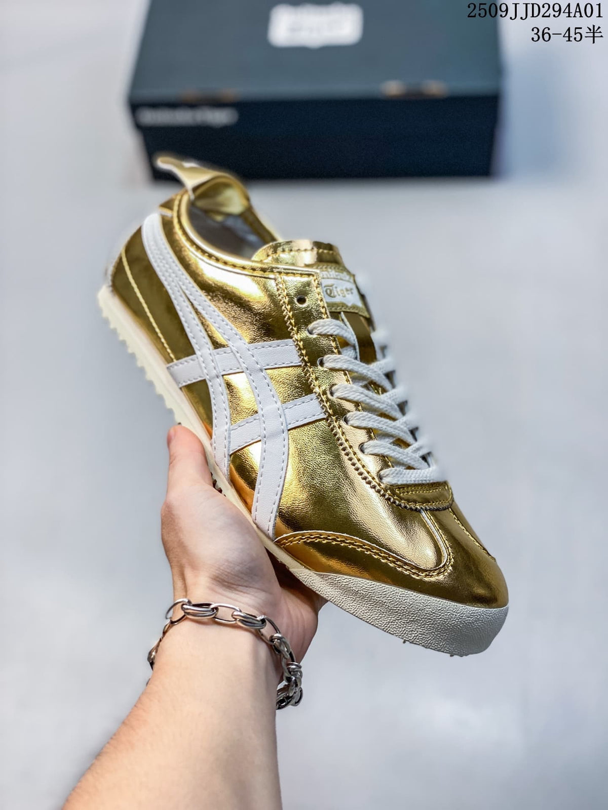 Gold metallic low-top sneaker with white side stripes and laces; size range text appears in the image.