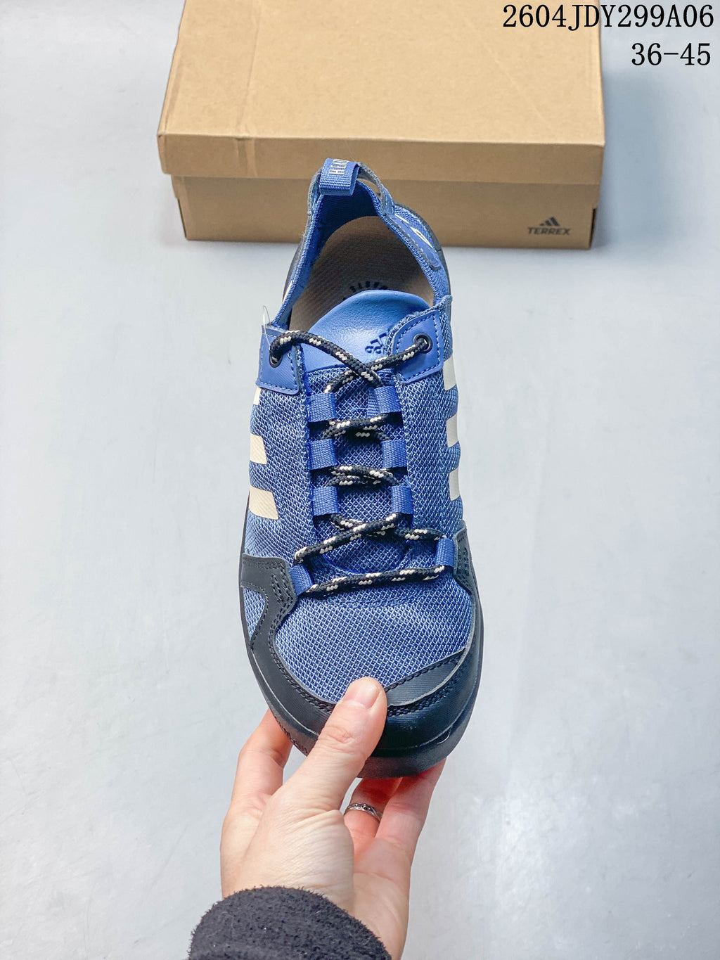 Top view of a blue Adidas outdoor shoe showing its lacing and mesh-look upper