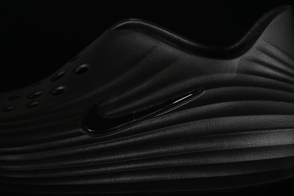 Close-up of the black side logo and sculpted ridges