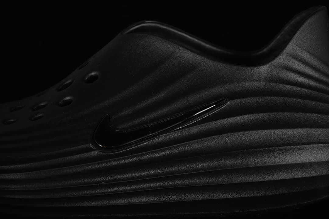 Close-up of the black side logo and sculpted ridges
