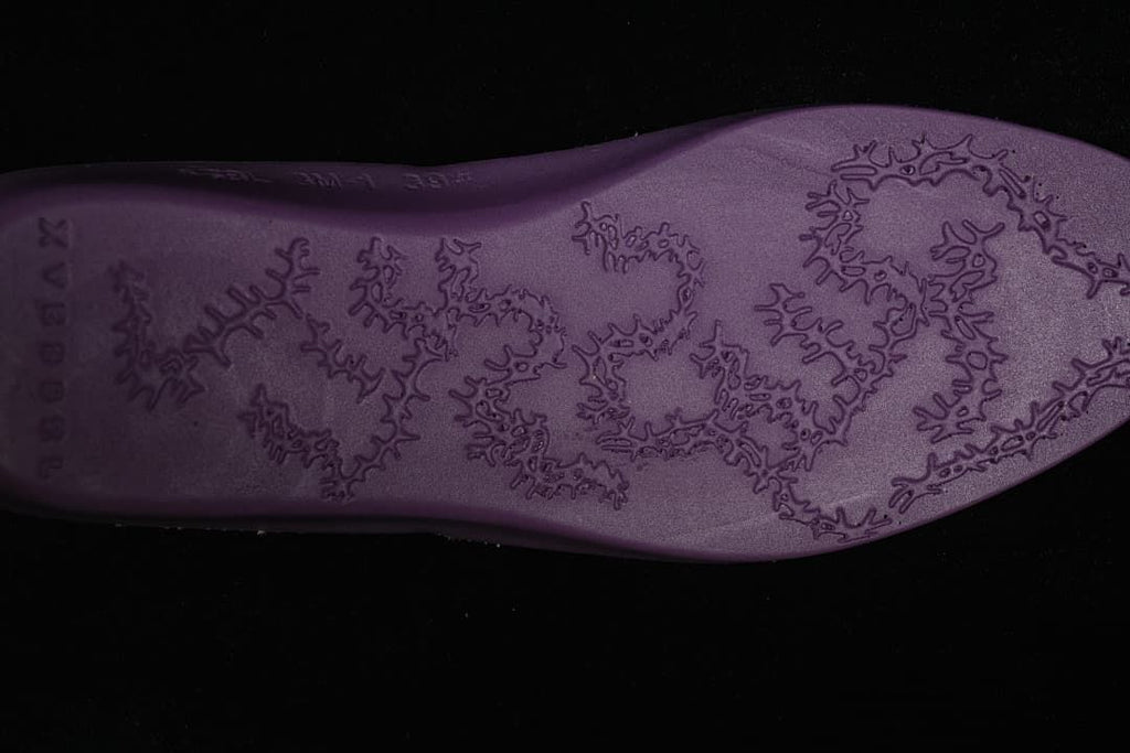 Close-up of the sneaker outsole with a raised snowflake-inspired pattern.