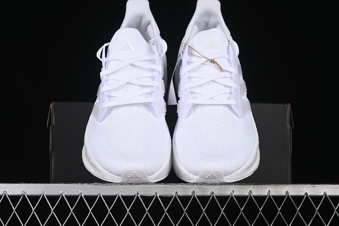 Front view of the pair showing the toes and laces.