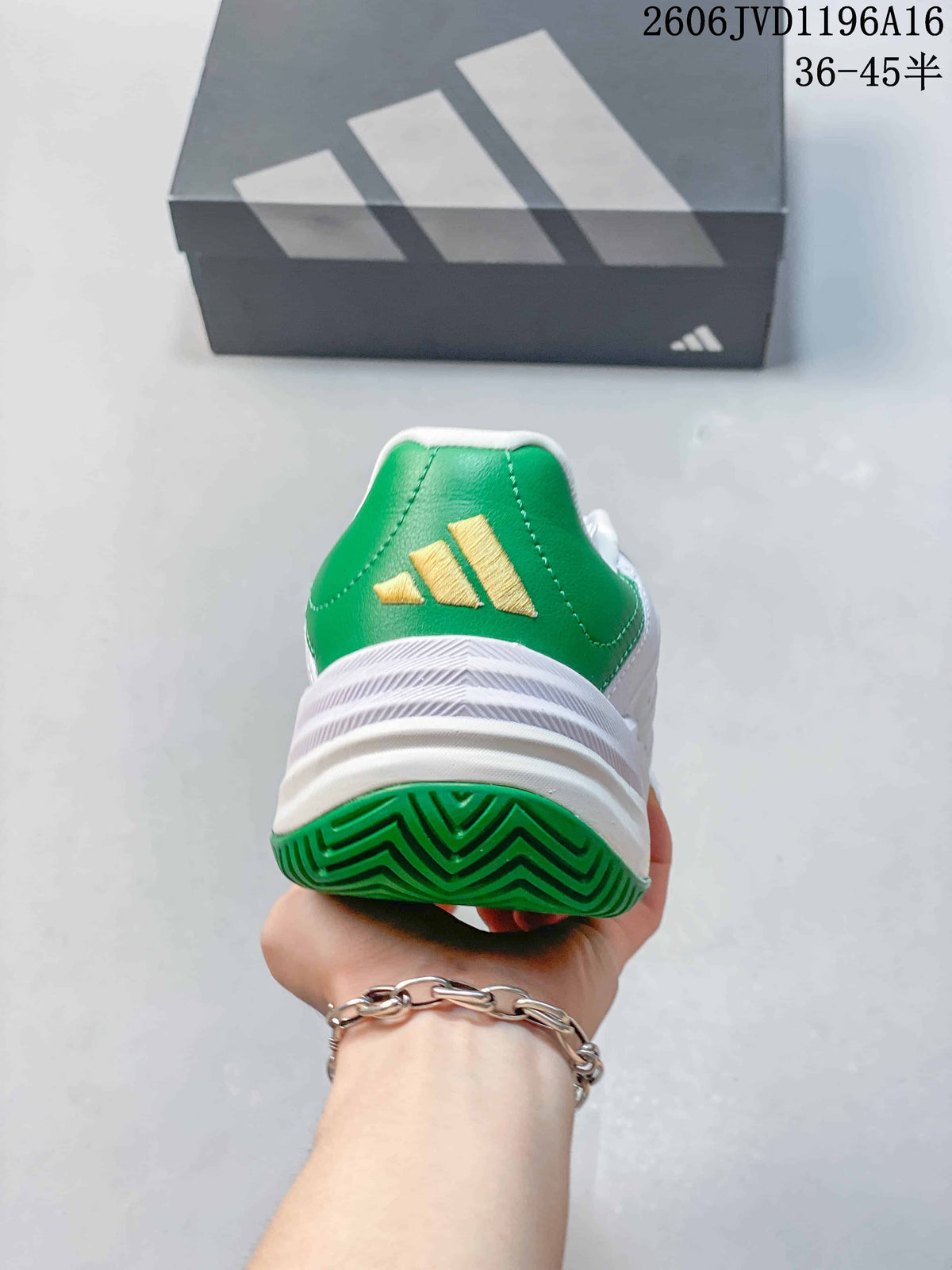 Rear view of the shoe with a green heel panel and gold-tone logo.