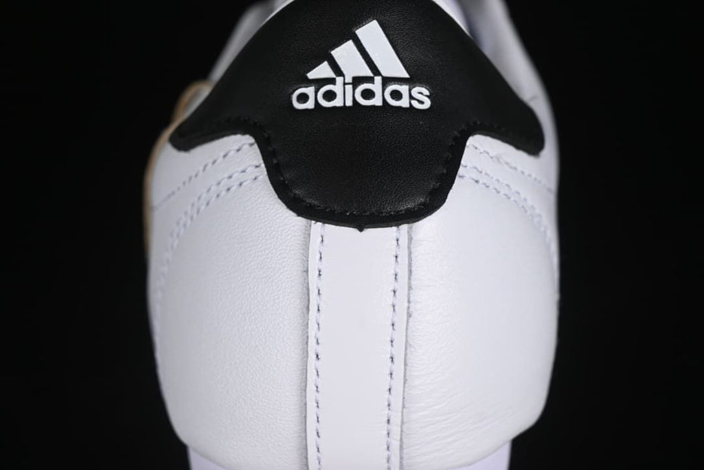 Heel close-up with black adidas heel panel.