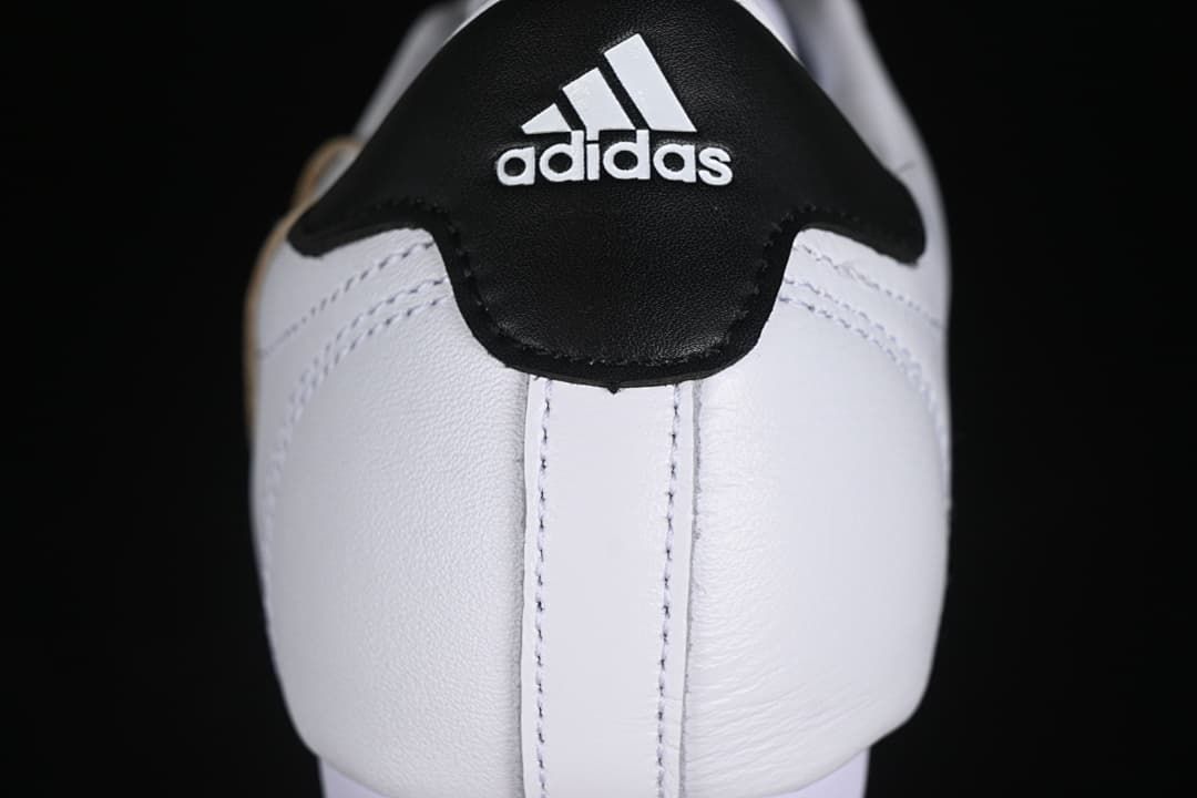 Heel close-up with black adidas heel panel.