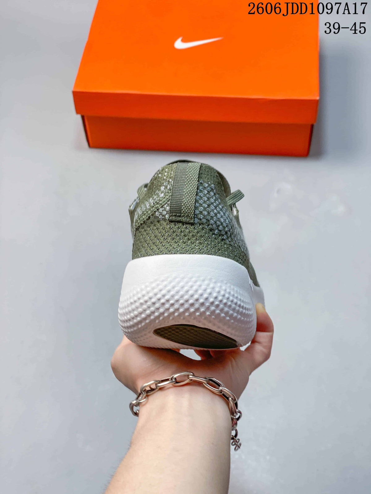 Rear view showing the heel pull tab and textured white sole.
