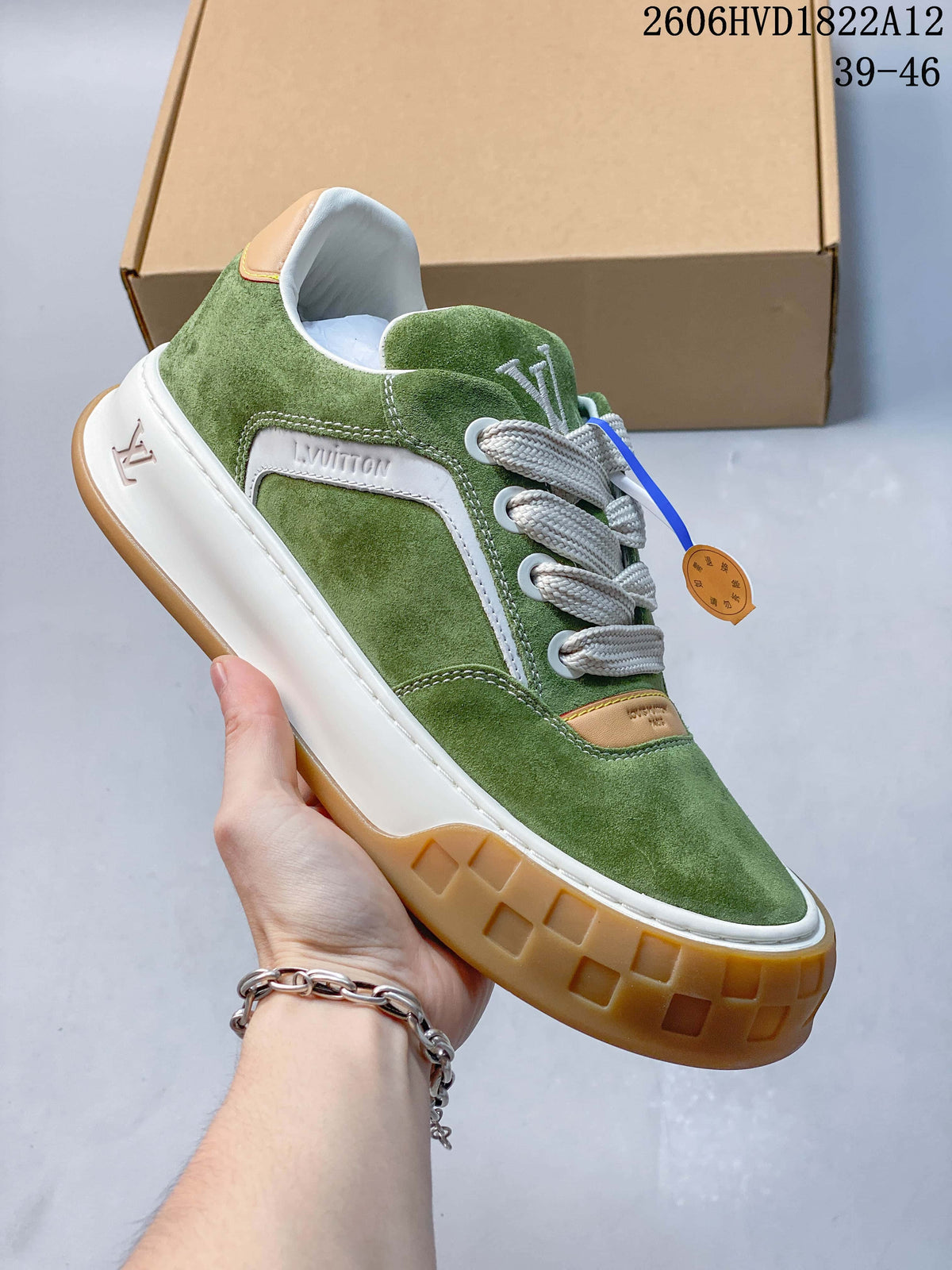 Angled view of the green sneaker showing its white side panel, wide laces, and thick sole