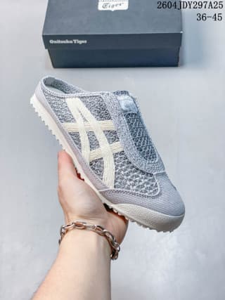 Side view of a grey and white Onitsuka Tiger Mexico 66 Sabot sneaker with layered side stripes and a textured upper.