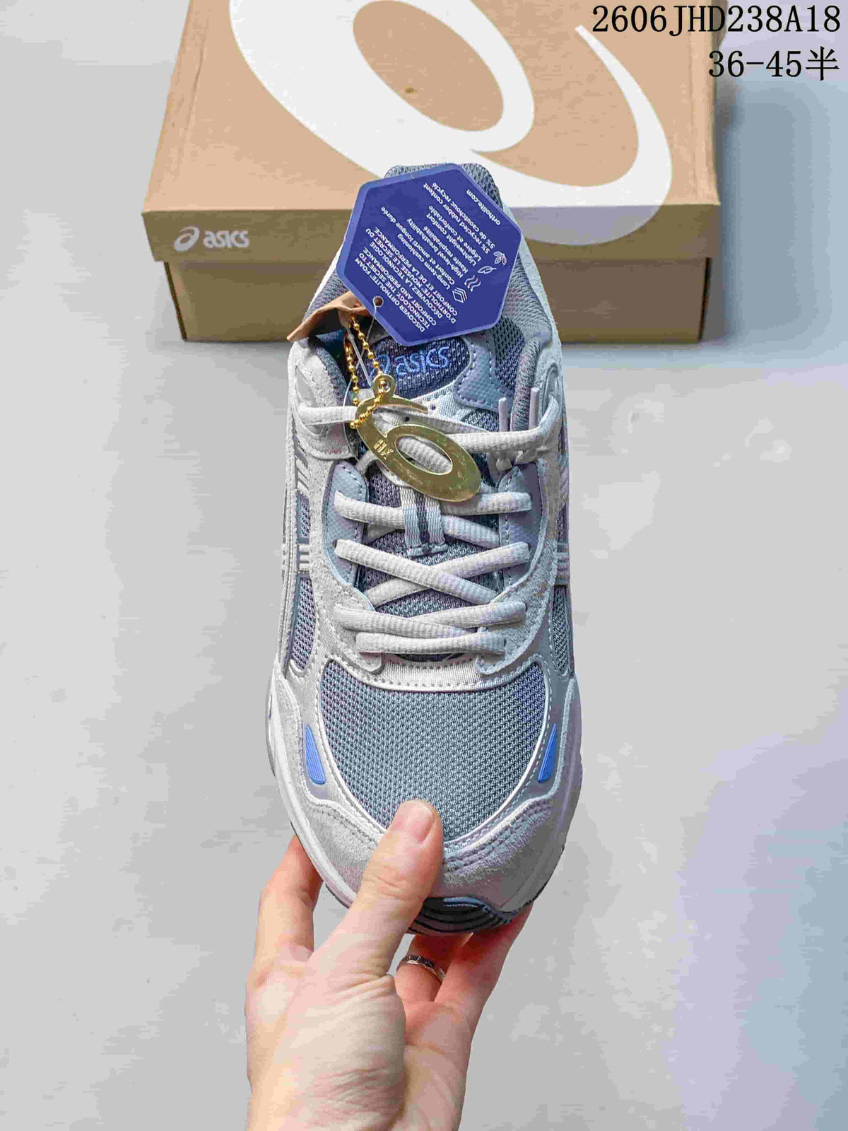 Top view of a grey and blue lace-up sneaker