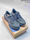 Pair of dark charcoal ASICS NOVABLAST 6 running shoes shown on a shoebox