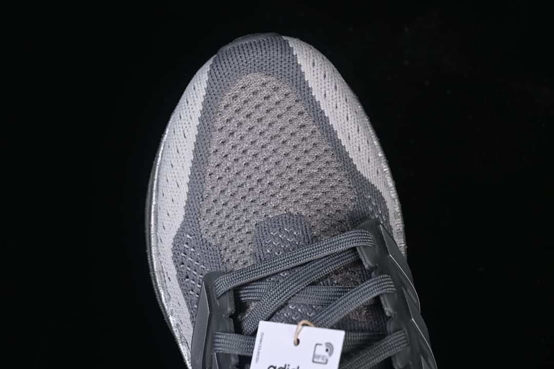 Top view of the grey knit-look toe and lace-up front