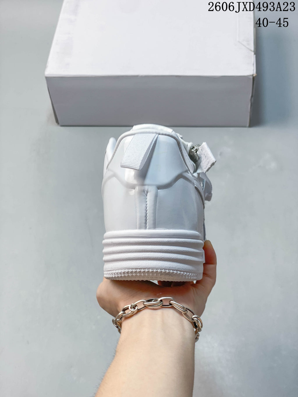 Rear view of the white low-top sneaker and layered sole