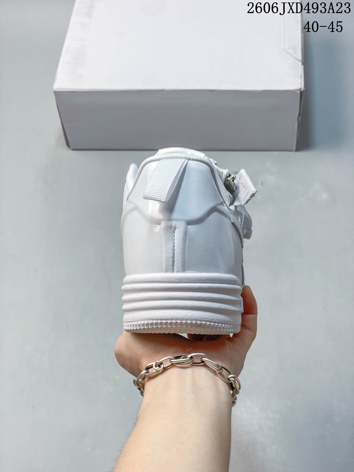 Rear view of the white low-top sneaker and layered sole