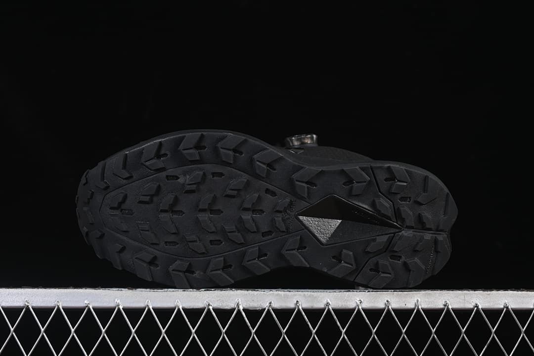Underside view showing the trail-style outsole lugs.