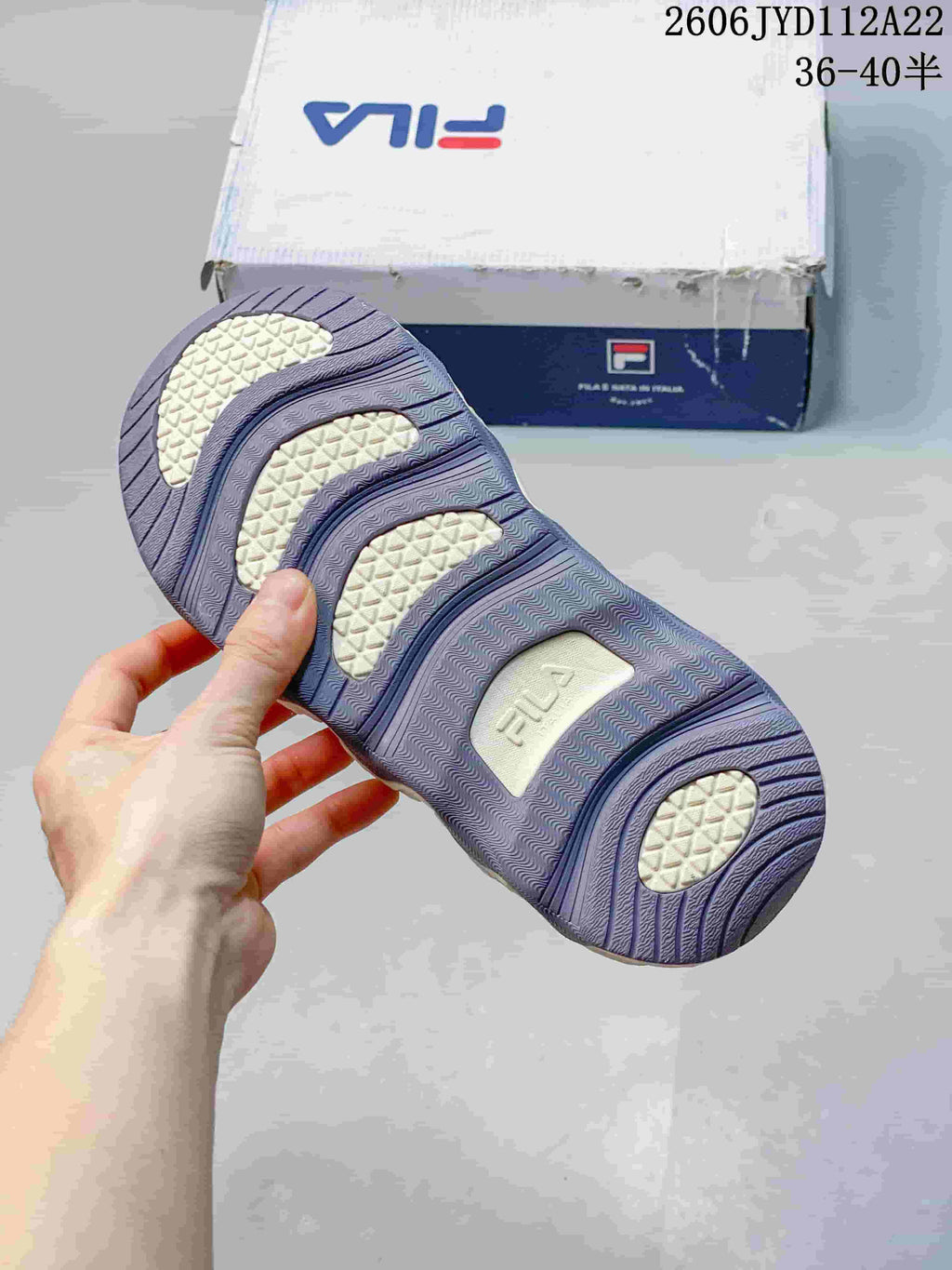 Underside of a FILA sneaker showing a patterned outsole