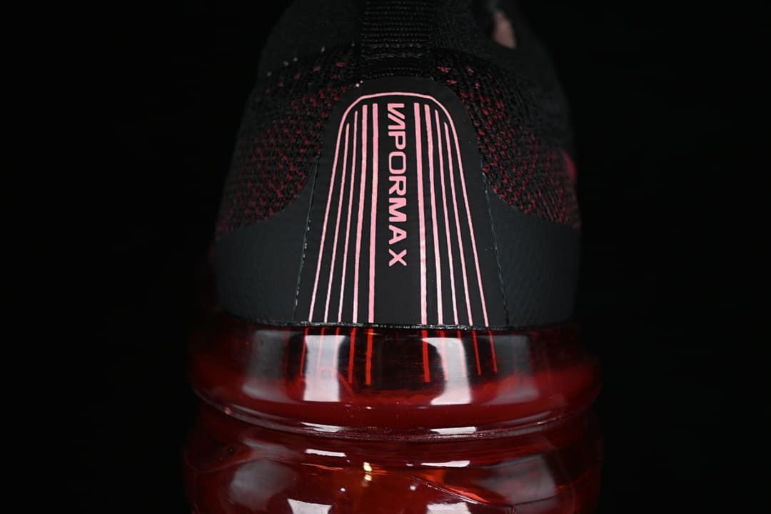Rear close-up of the shoe with VaporMax branding and translucent red sole