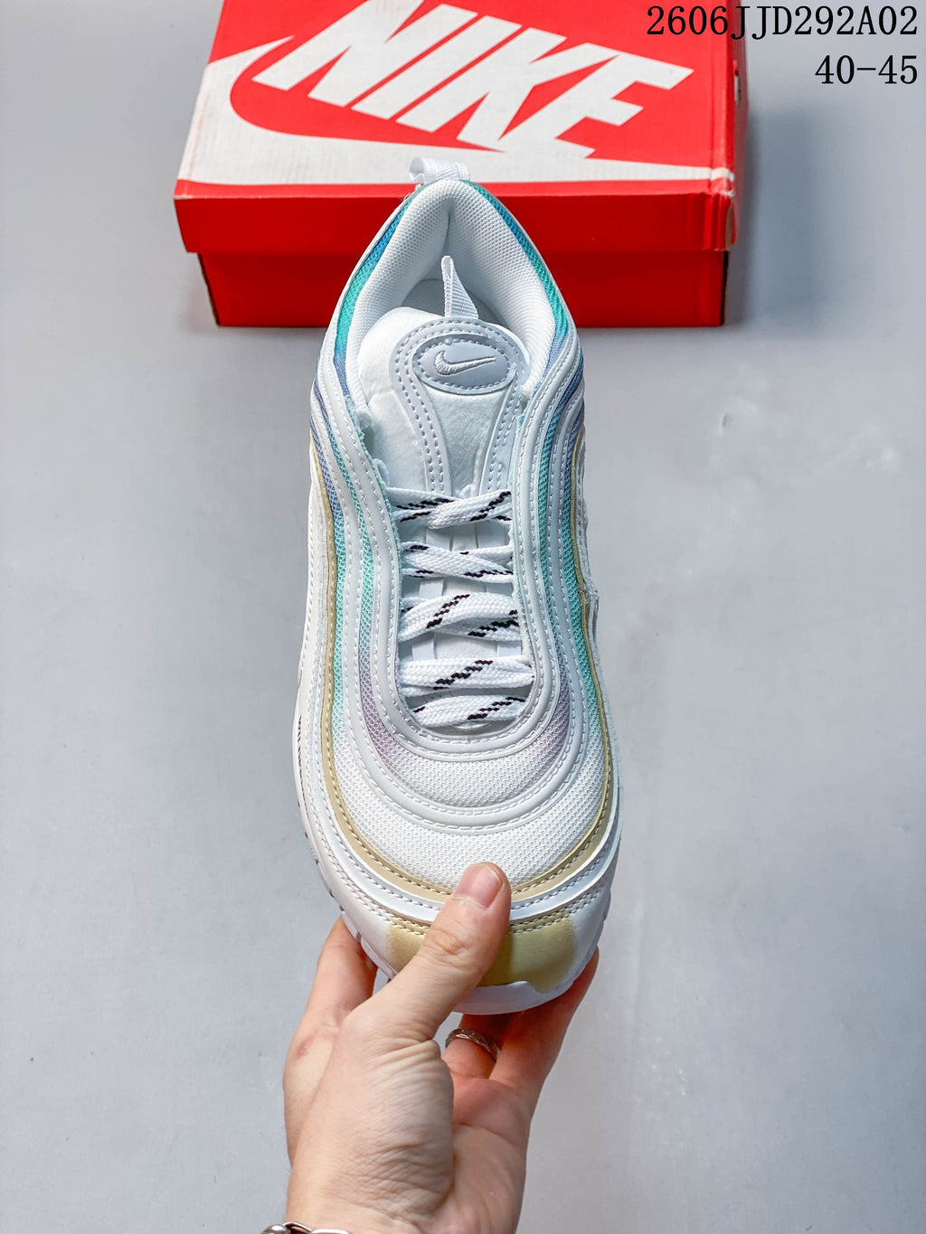 Top view of a Nike Air Max 97 sneaker showing its laces and layered upper