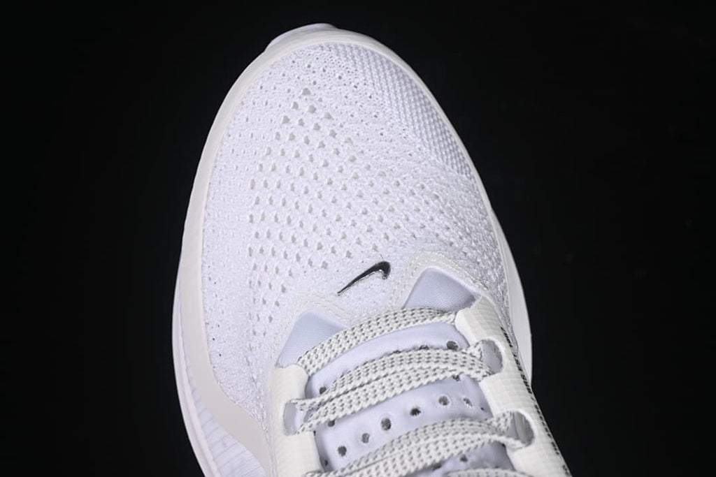Top view of the perforated mesh toe and lace area.