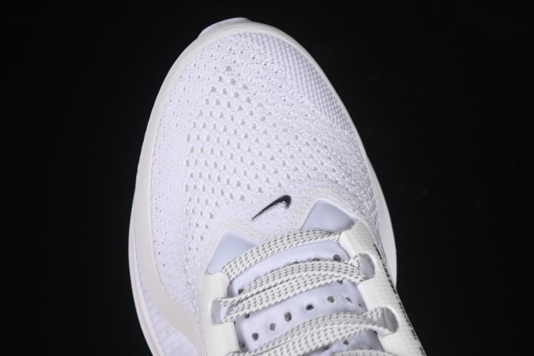 Top view of the perforated mesh toe and lace area.