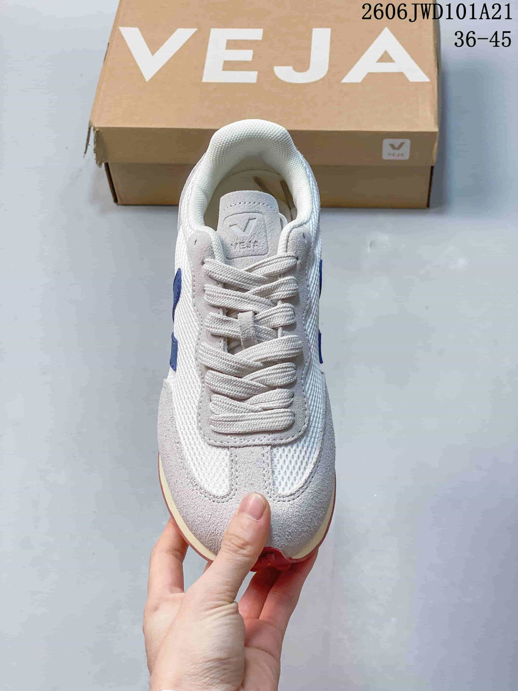 Top view of the lace-up Veja sneaker in white and light gray