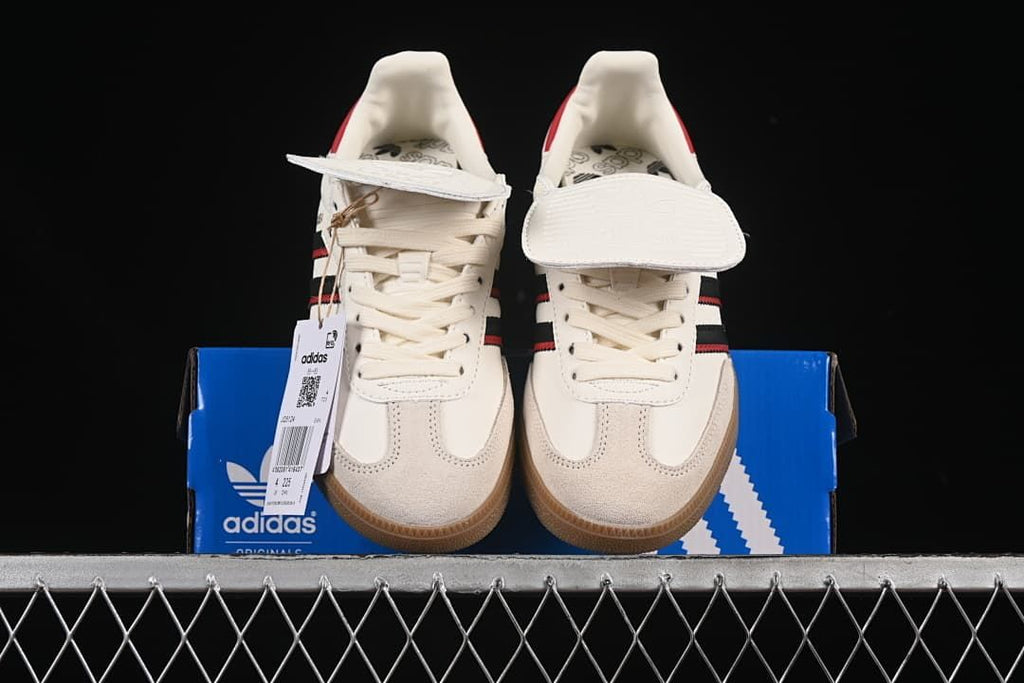 Front view of the pair on a blue adidas shoe box.