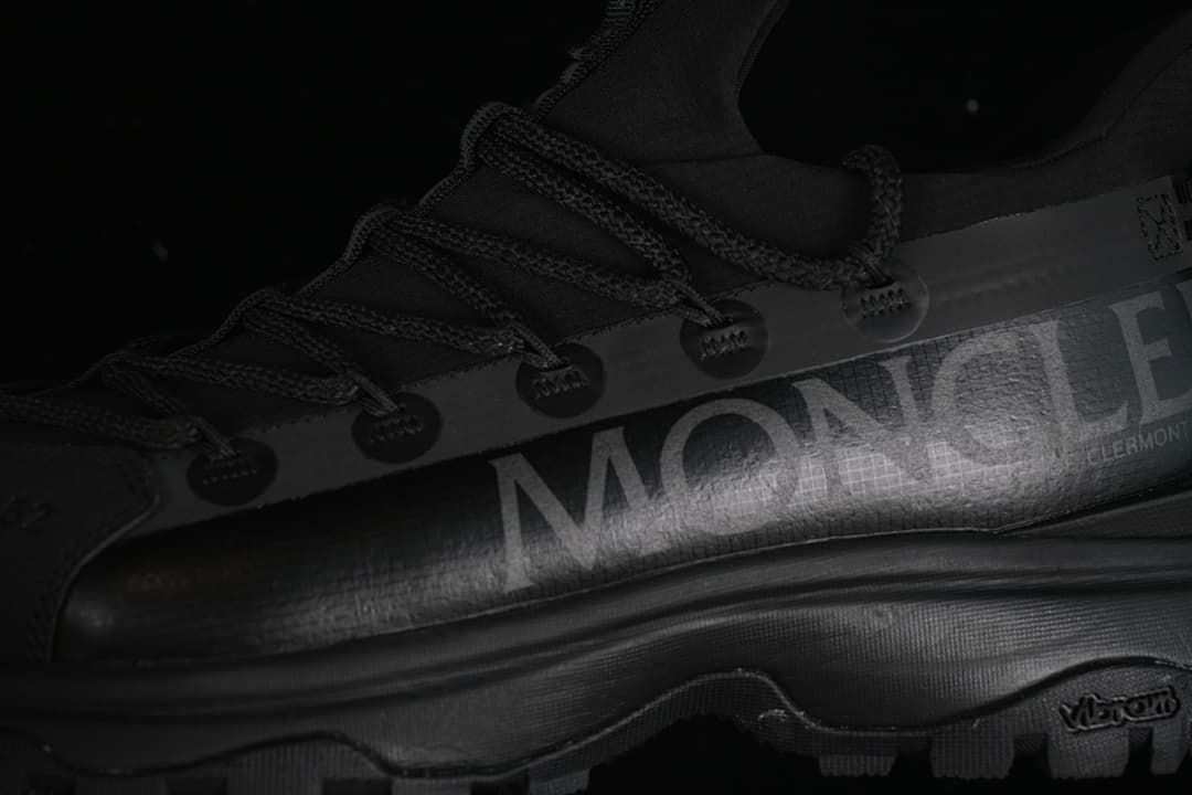 Close-up of the side branding, lace guides and lugged outsole