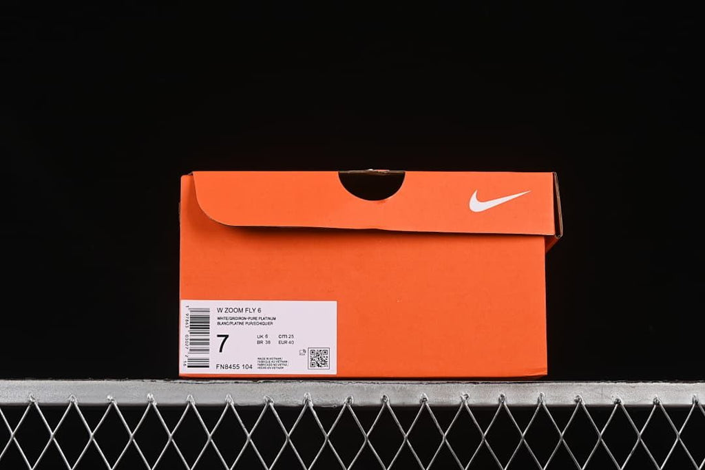Orange Nike shoe box with a label identifying the Zoom Fly 6 and style code FN8455-104.