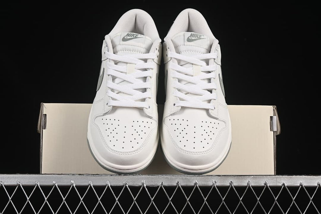 Front view of the pair showing perforated toes and laces