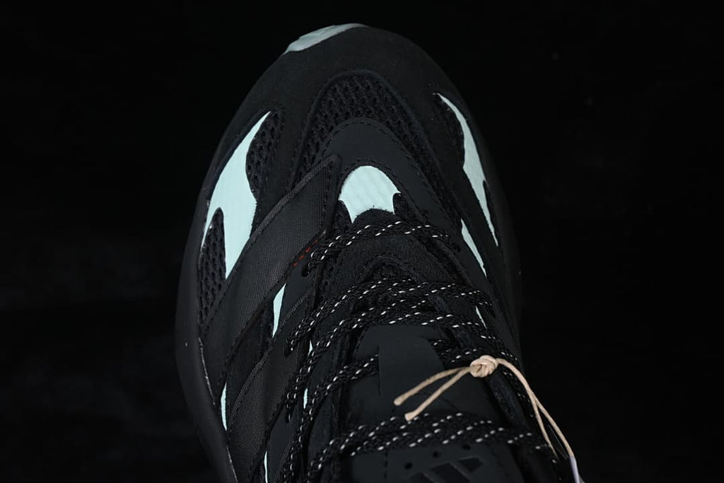 Top view of the toe, mesh panels, and contrasting pale accents