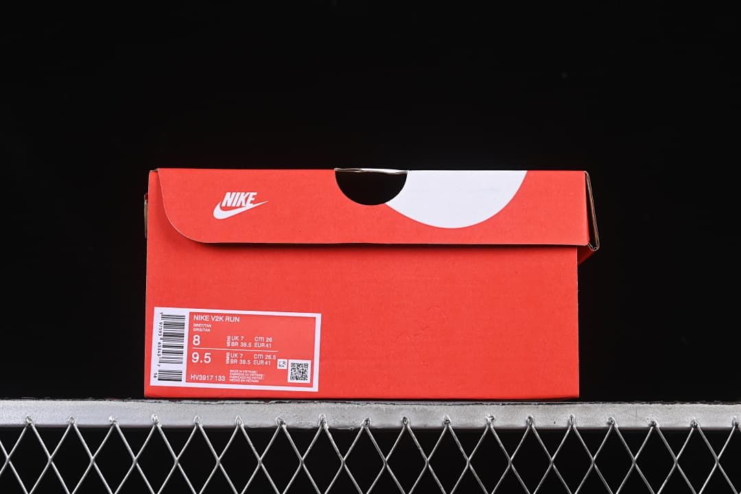 Red Nike shoe box with V2K Run style and size label