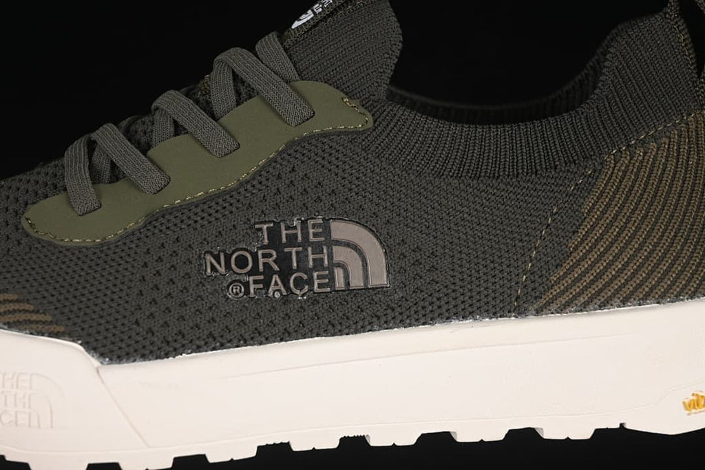 Close-up of the side logo, laces, and textured upper