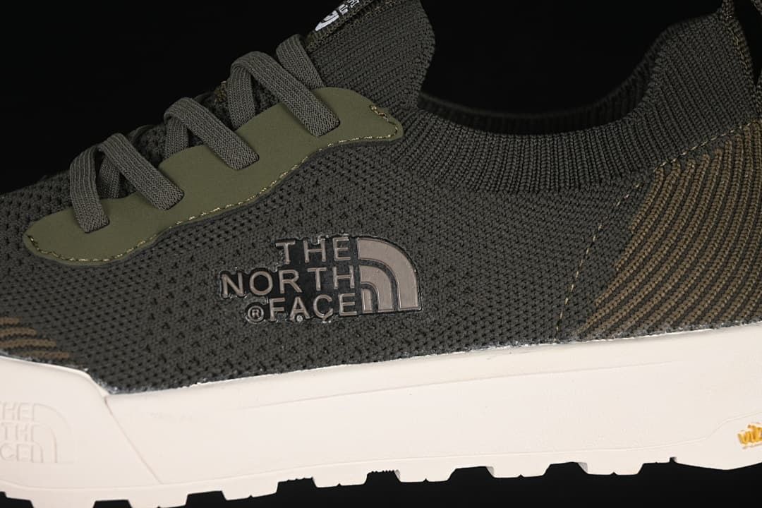 Close-up of the side logo, laces, and textured upper