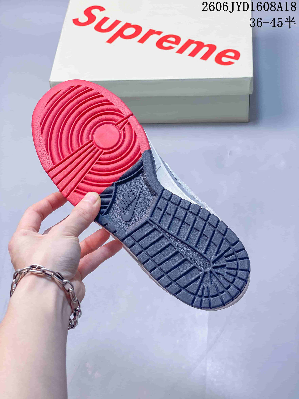 Close-up of the sneaker's red and navy two-tone outsole.