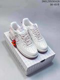 Pair of white and pale pink low-top sneakers with a dangling charm