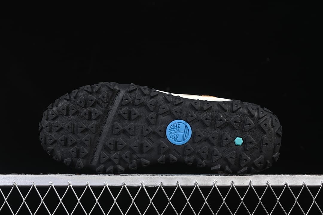 Underside of the boot with a black geometric tread pattern