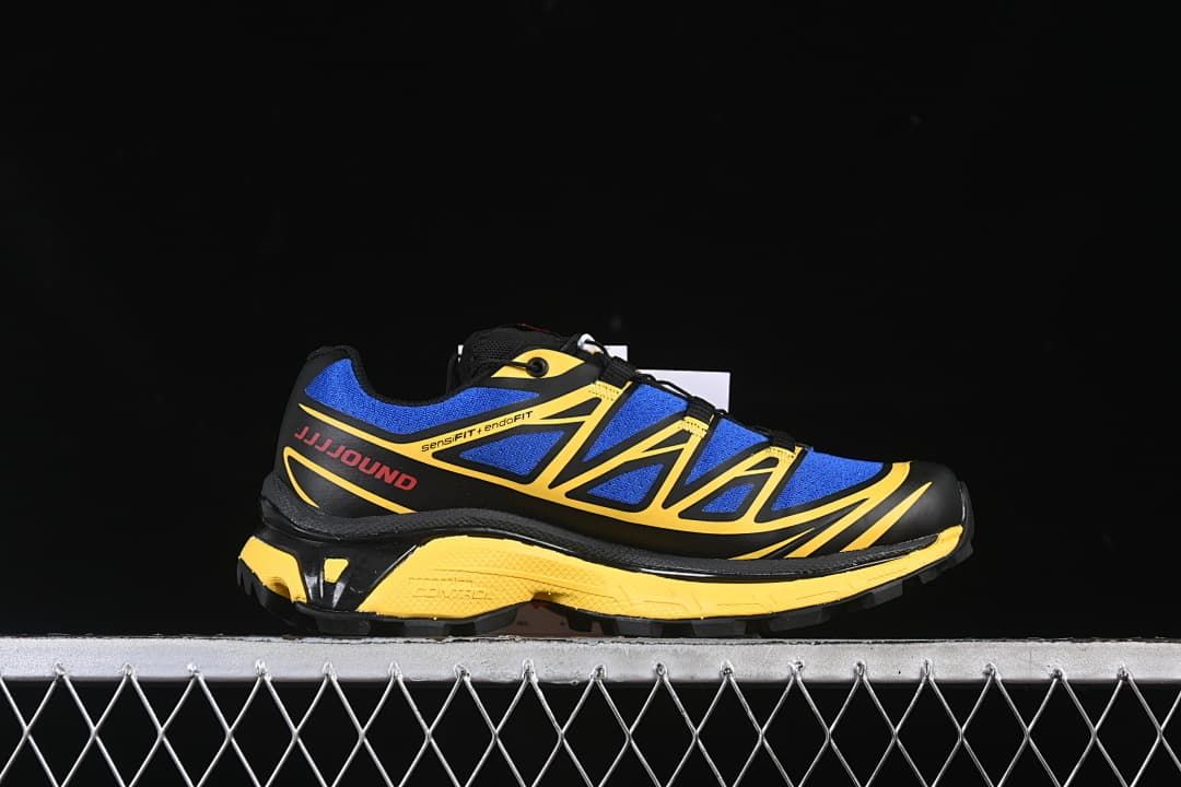 Side profile highlighting the blue and yellow upper and sculpted midsole