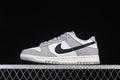 Side view of a white, grey, and black Nike Dunk Low Style sneaker