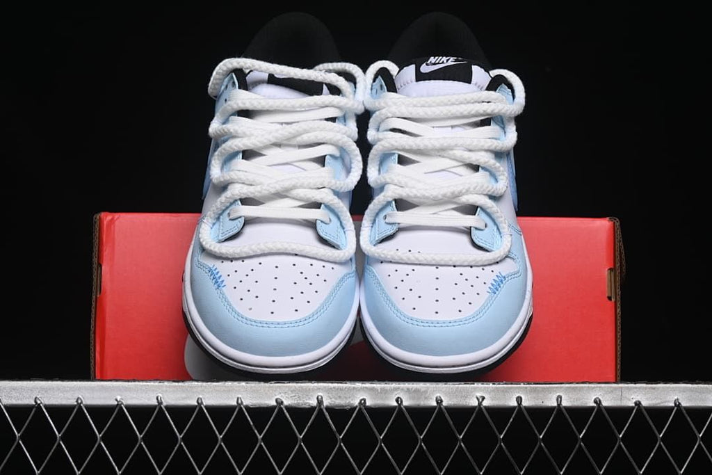 Front view of the pair showing perforated toe boxes and oversized laces