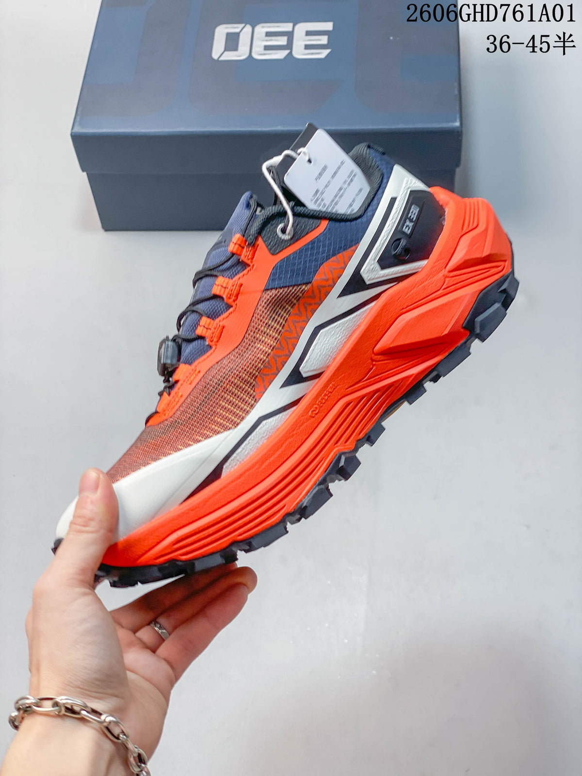 Side view of the Kailas FUGA EX330 trail shoe with quick-lace closure and orange midsole