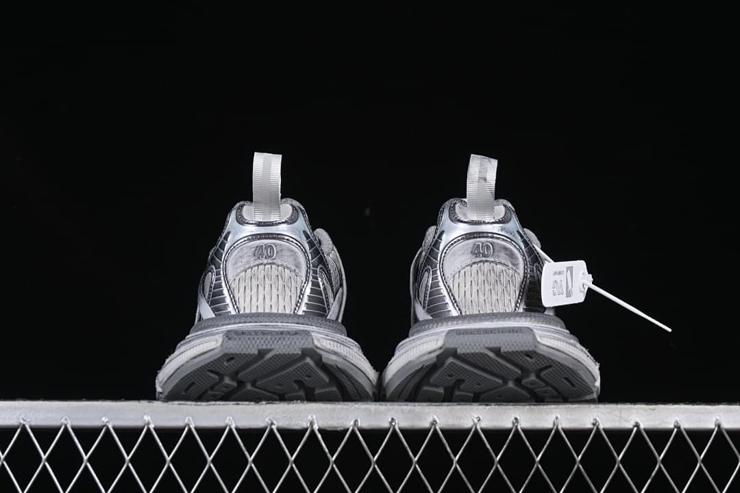 Rear view of the pair showing heel panels and outsole edges