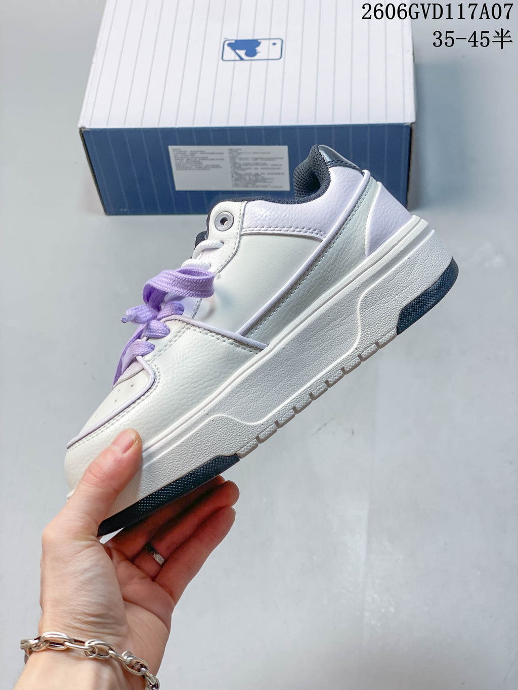 Side profile of a white and lavender MLB Chunky Liner low-top sneaker