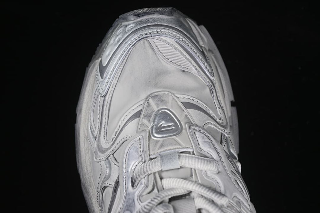 Top-down close-up of the lace area and layered toe panels.