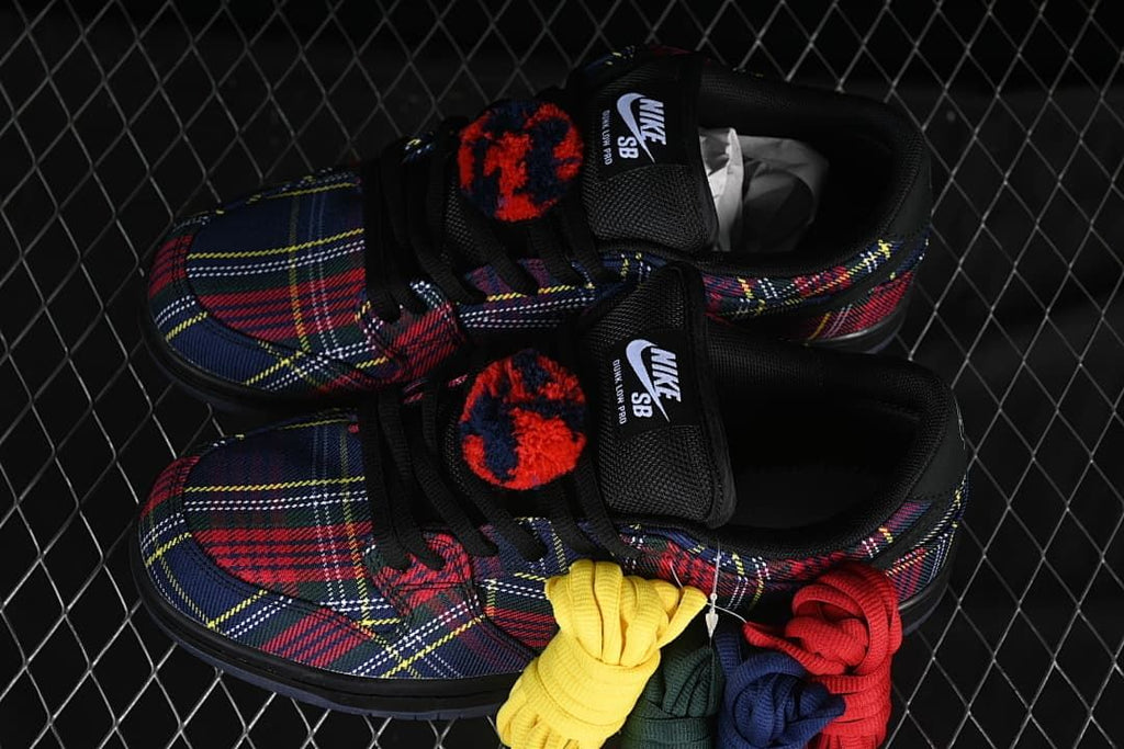 Pair of plaid sneakers photographed with several colored lace options.