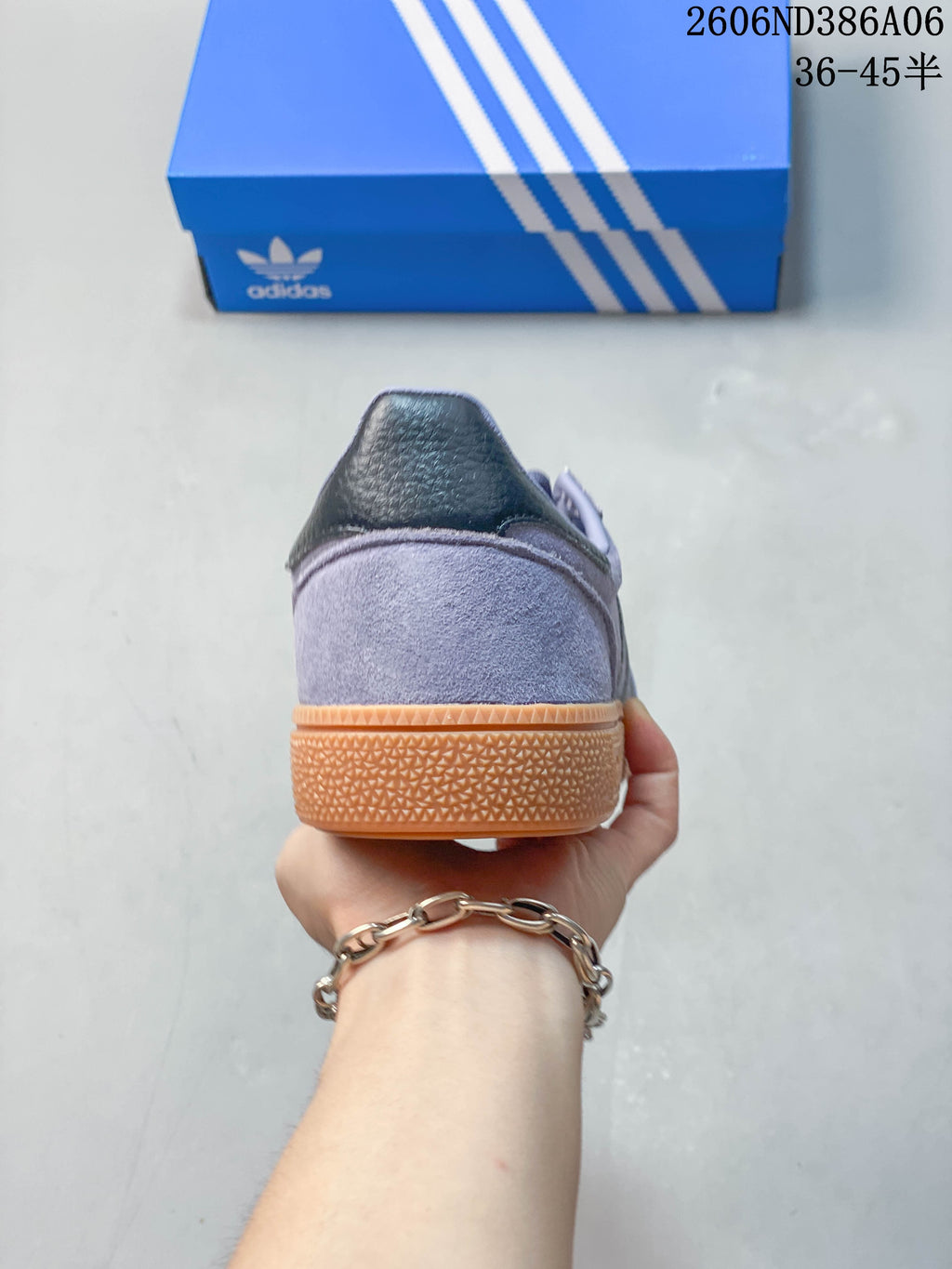 Rear view of the sneaker showing the heel and gum-colored sole