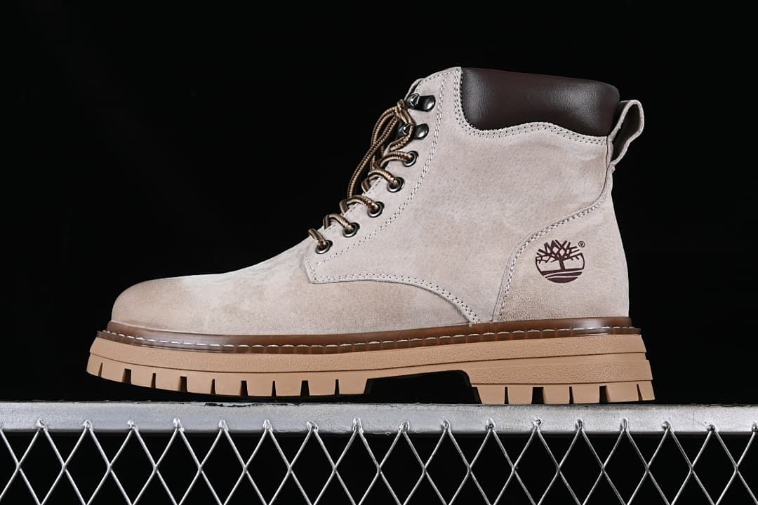Side view of a beige-grey Timberland TB10078 mid-height lace-up boot