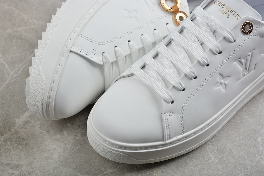 Close-up of the white toe, stitching and lace-up front