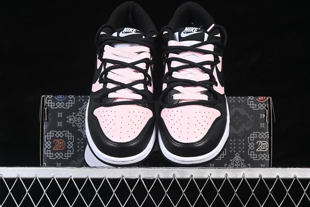 Front view of both sneakers displayed on the shoebox