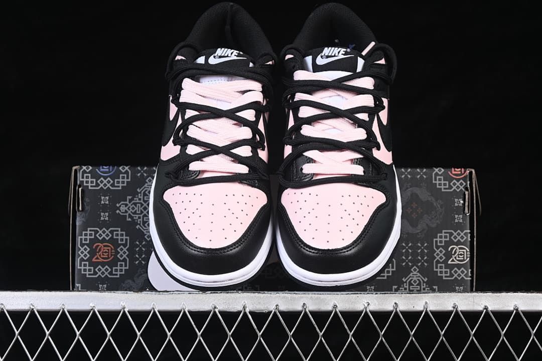 Front view of both sneakers displayed on the shoebox