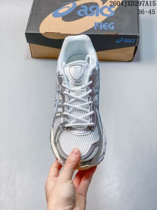 Top view of the Light Sage ASICS sneaker showing the layered toe, lace area, and branded shoe box.