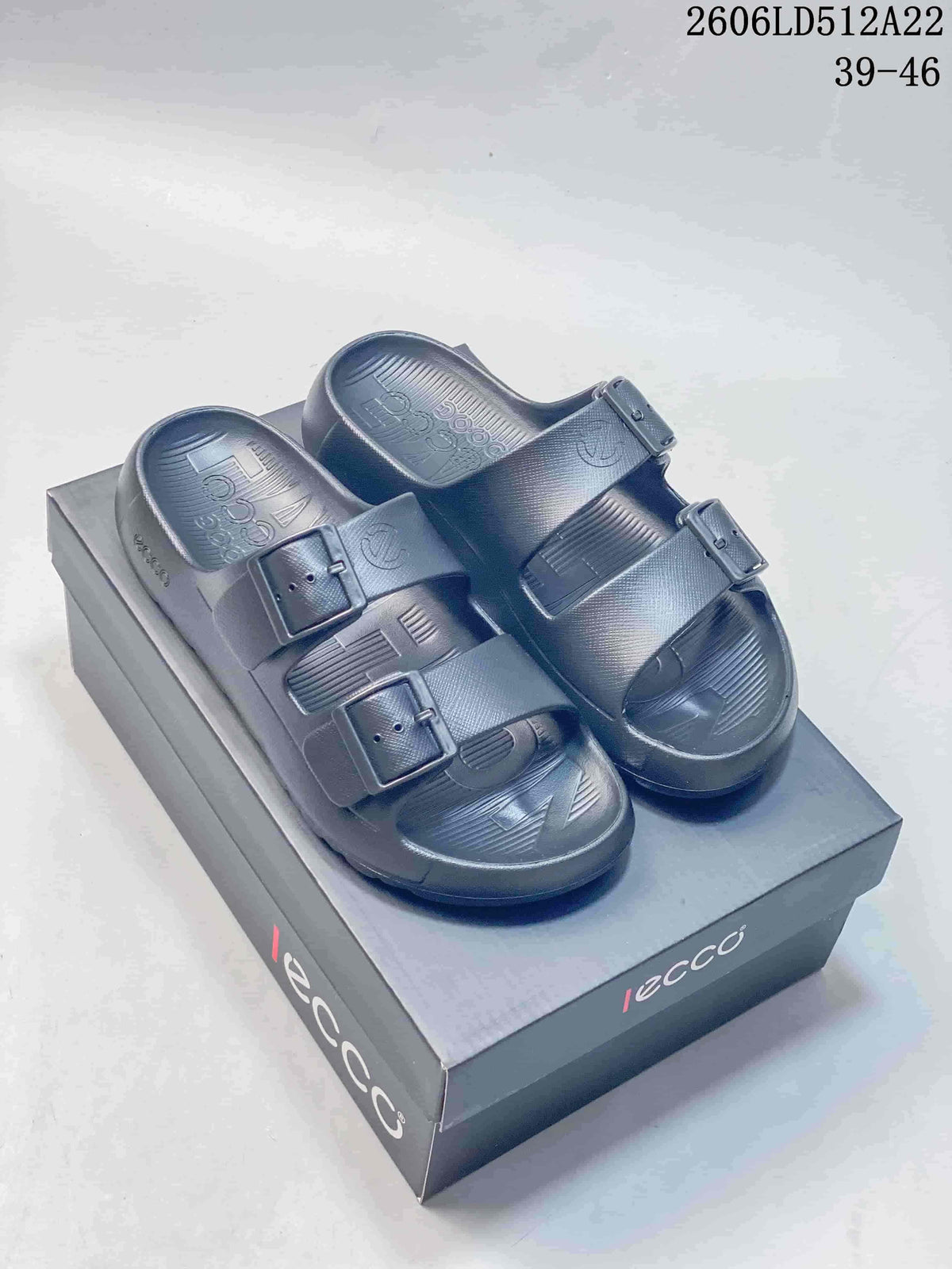 Dark gray ECCO sandals with two buckle straps, shown on a branded box; image also displays style code 2606LD512A22 and sizes 39–46.